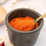 homemade sambar powder in a black jar
