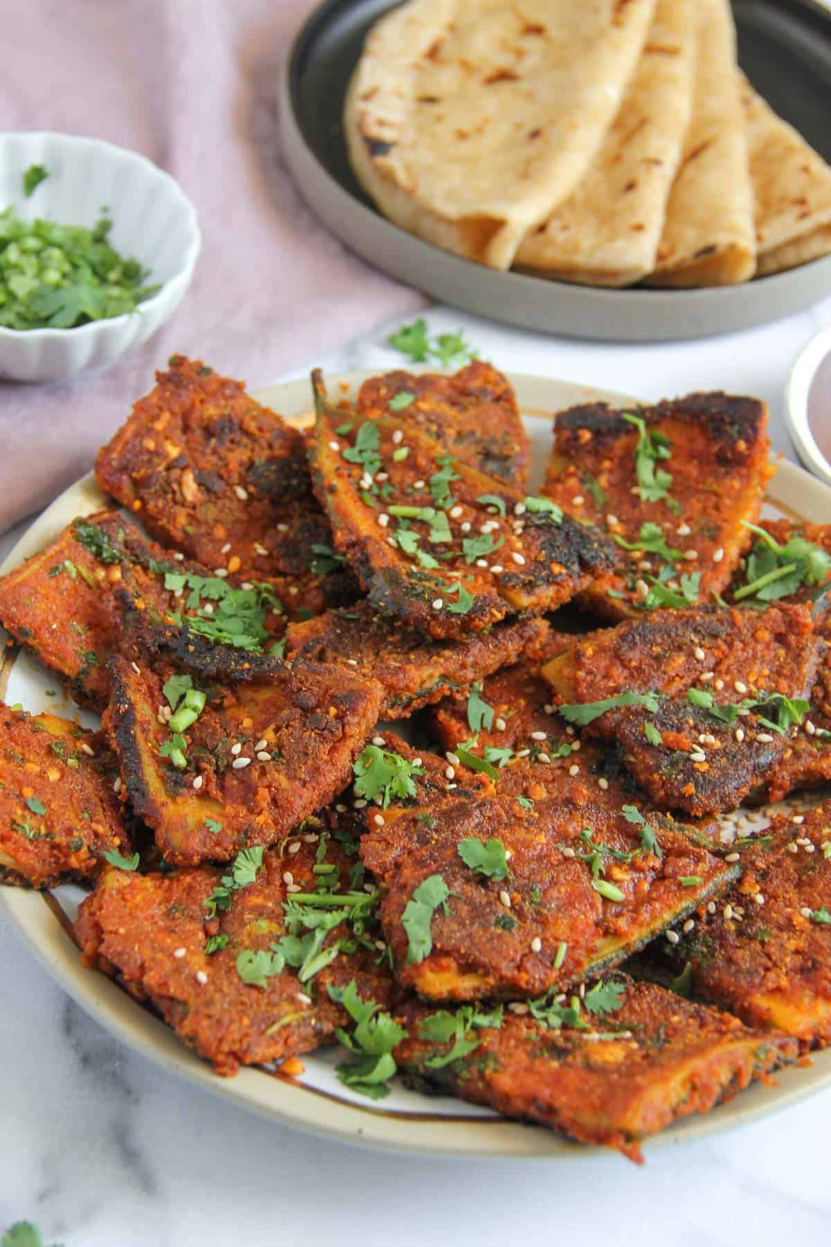 Karela fry garnished with sesame seeds and cilantro