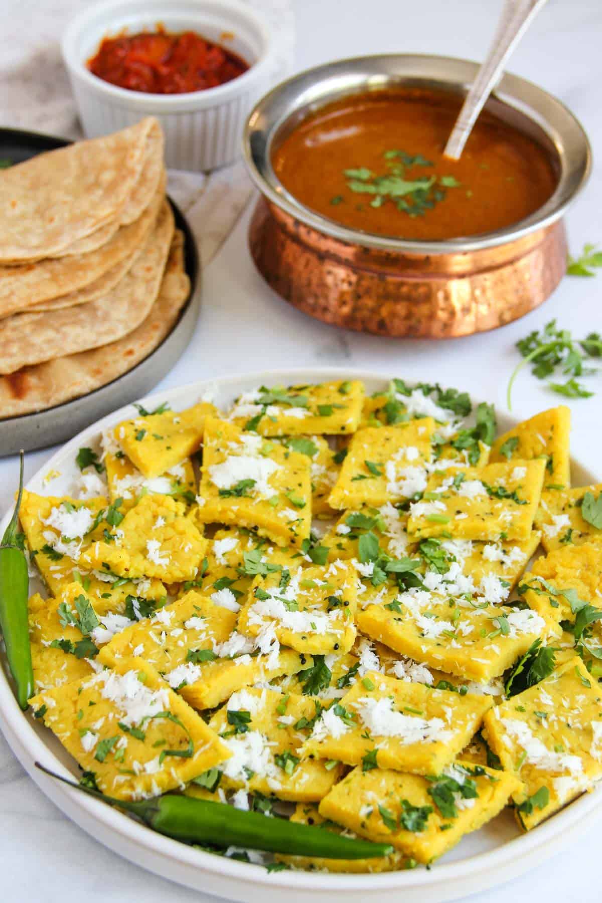 diamond shaped patwadi garnished with coconut and cilantro 