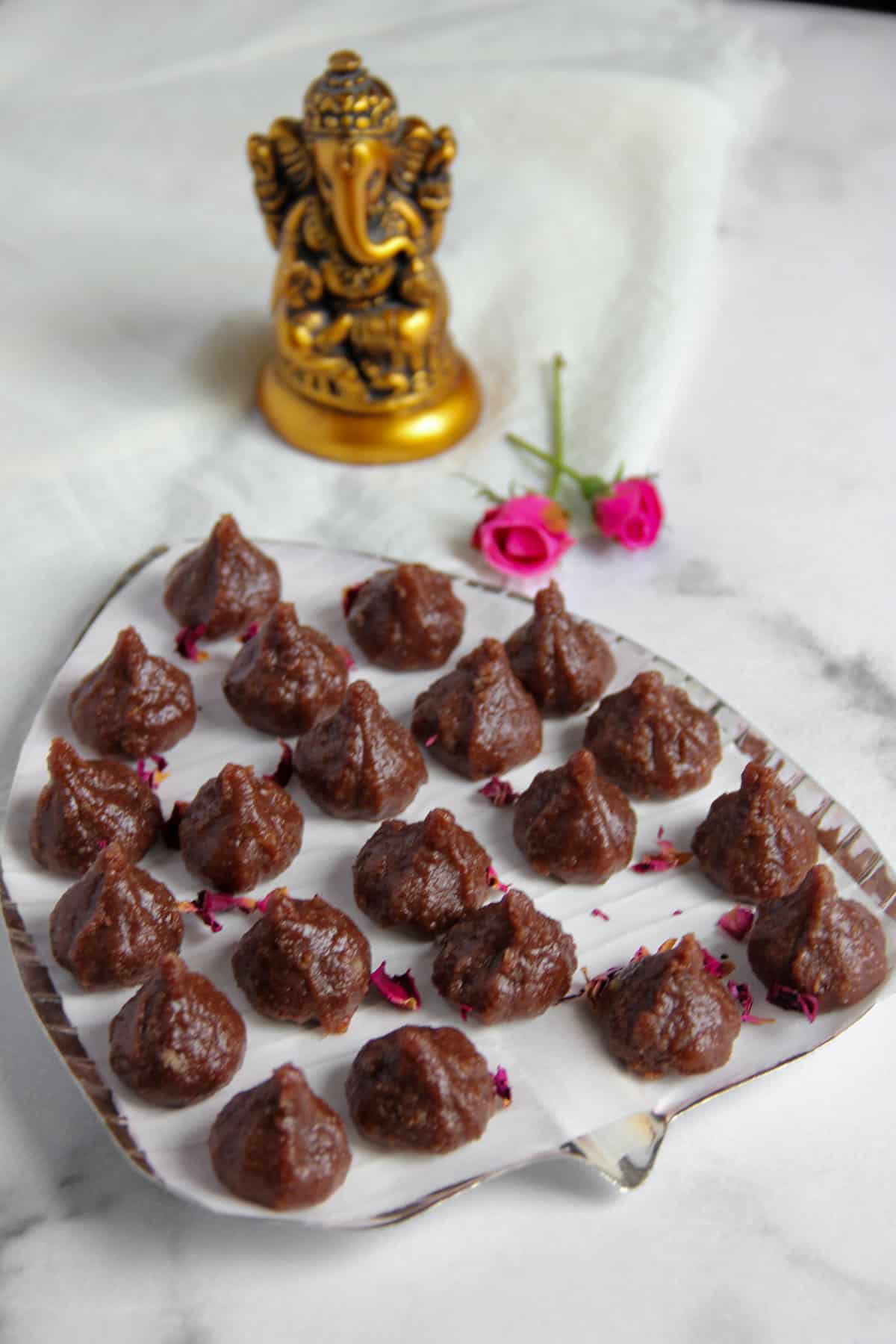 chocolate modak in a silver platter