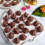 chocolate modak garnished with dried rose petals