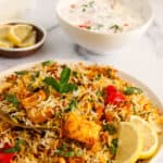 veg dum biryani garnished with mint and cilantro