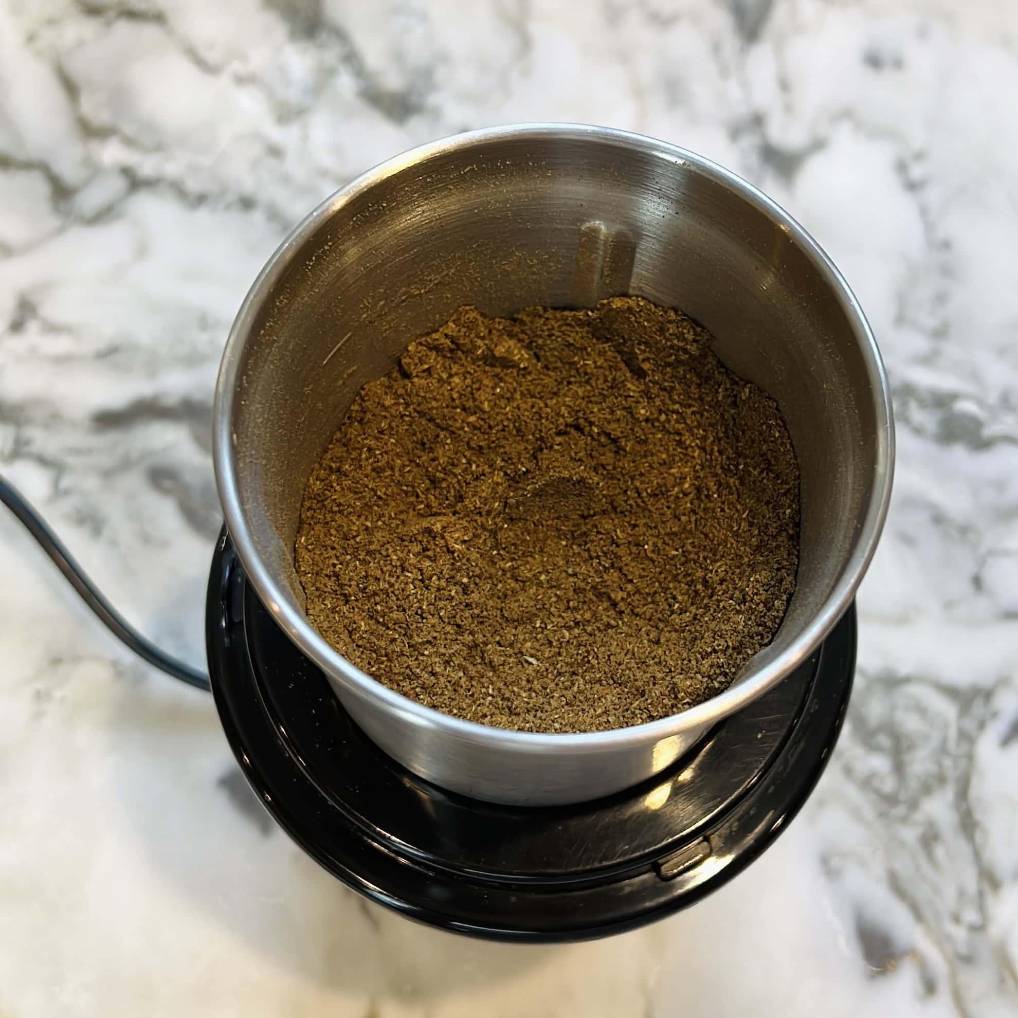 ground biryani powder in a mixer jar