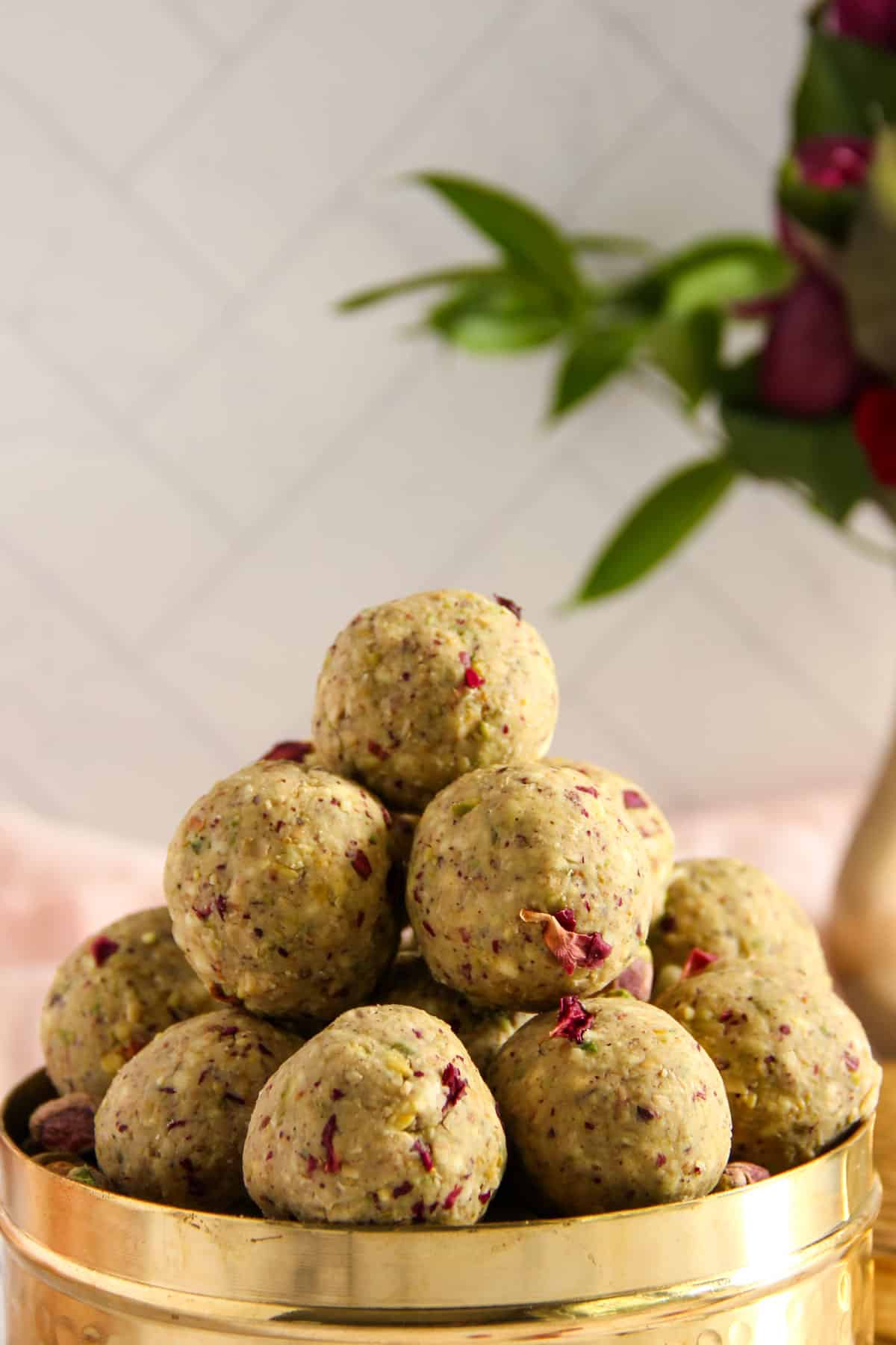 oats pistachio laddu stacked in a container
