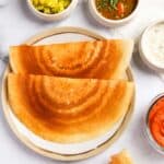 crispy dosa served with sambar, chutney and spicy potatoes