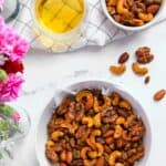 masala nuts in two white bowls