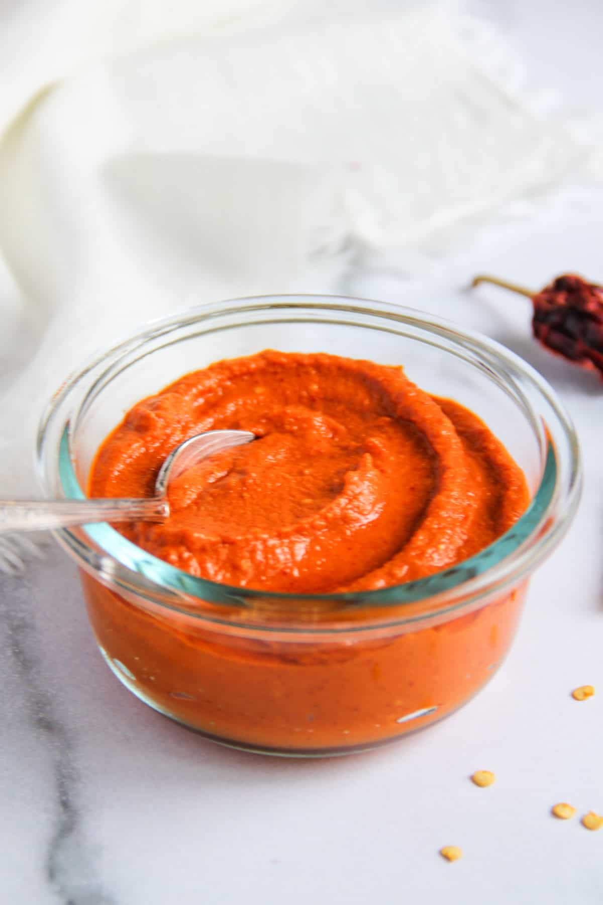 red dosa chutney in a glass bowl