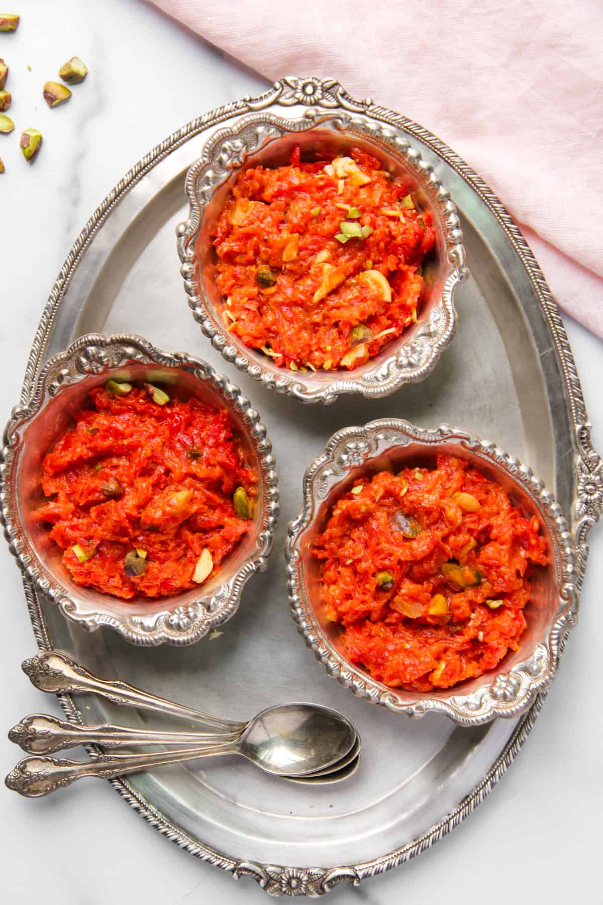 Gajar ka halwa in three silver bowls
