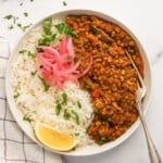 green mung dal served with rice and pickled onions