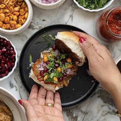 Assembled Dabeli with all the garnish.