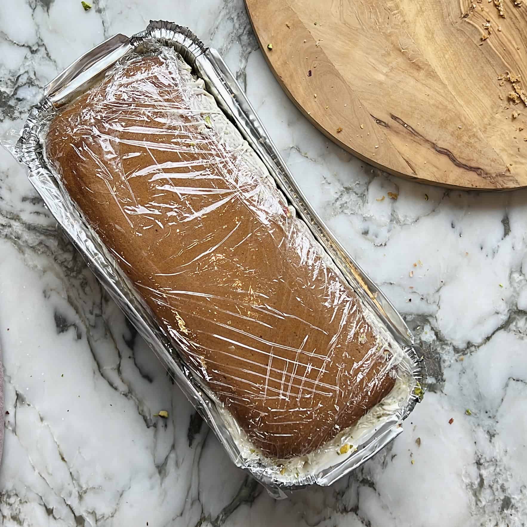 ice cream cake wrapped in saran wrap 