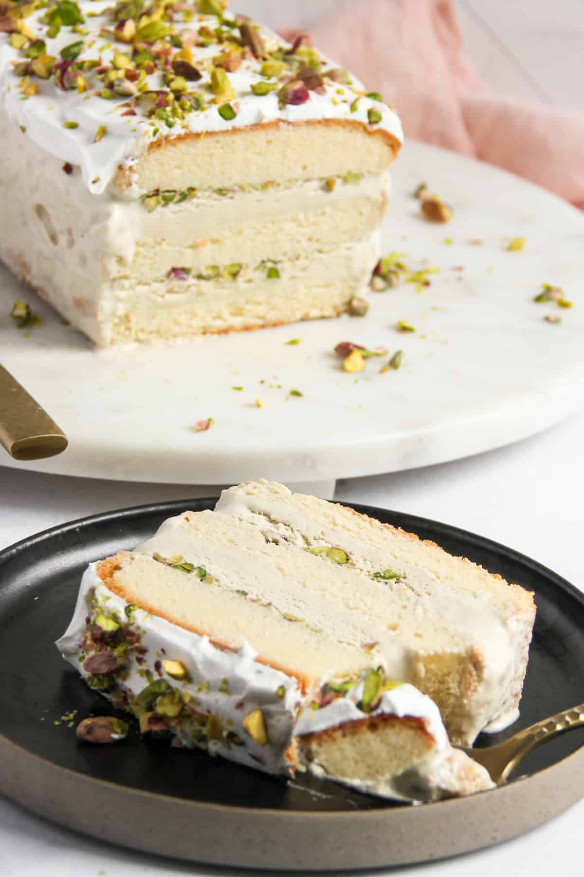 Pistachio Ice Cream Cake slice on a plate.
