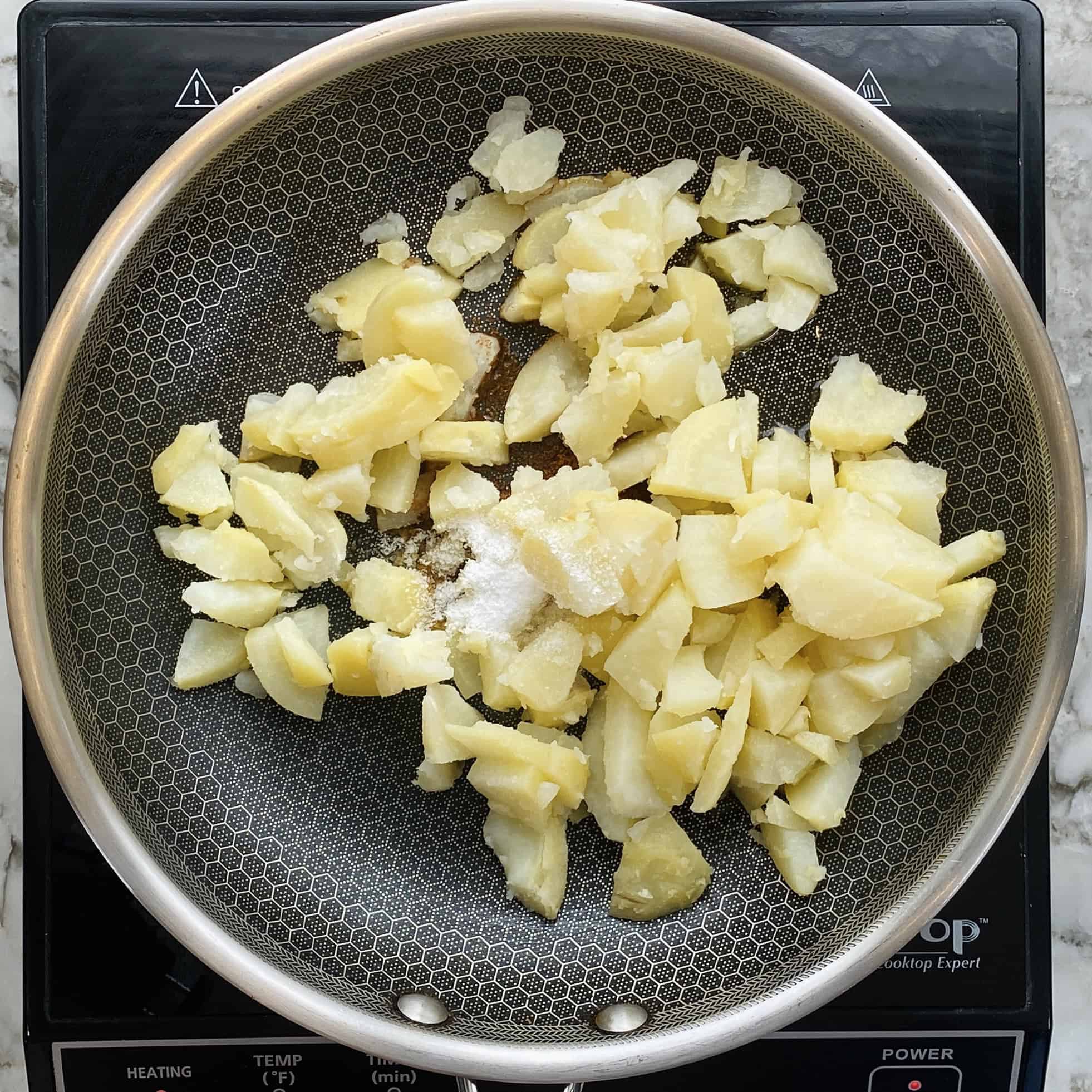 diced potatoes in a pan.