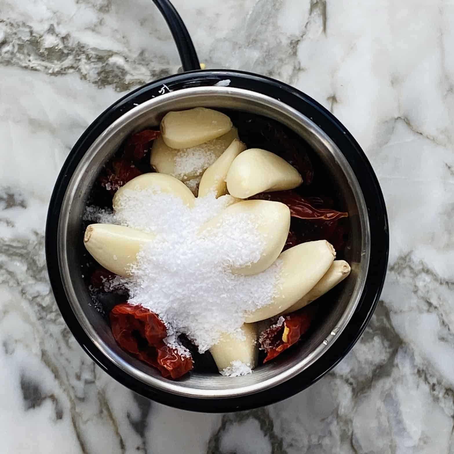 red chutney ingredients added to blender jar.