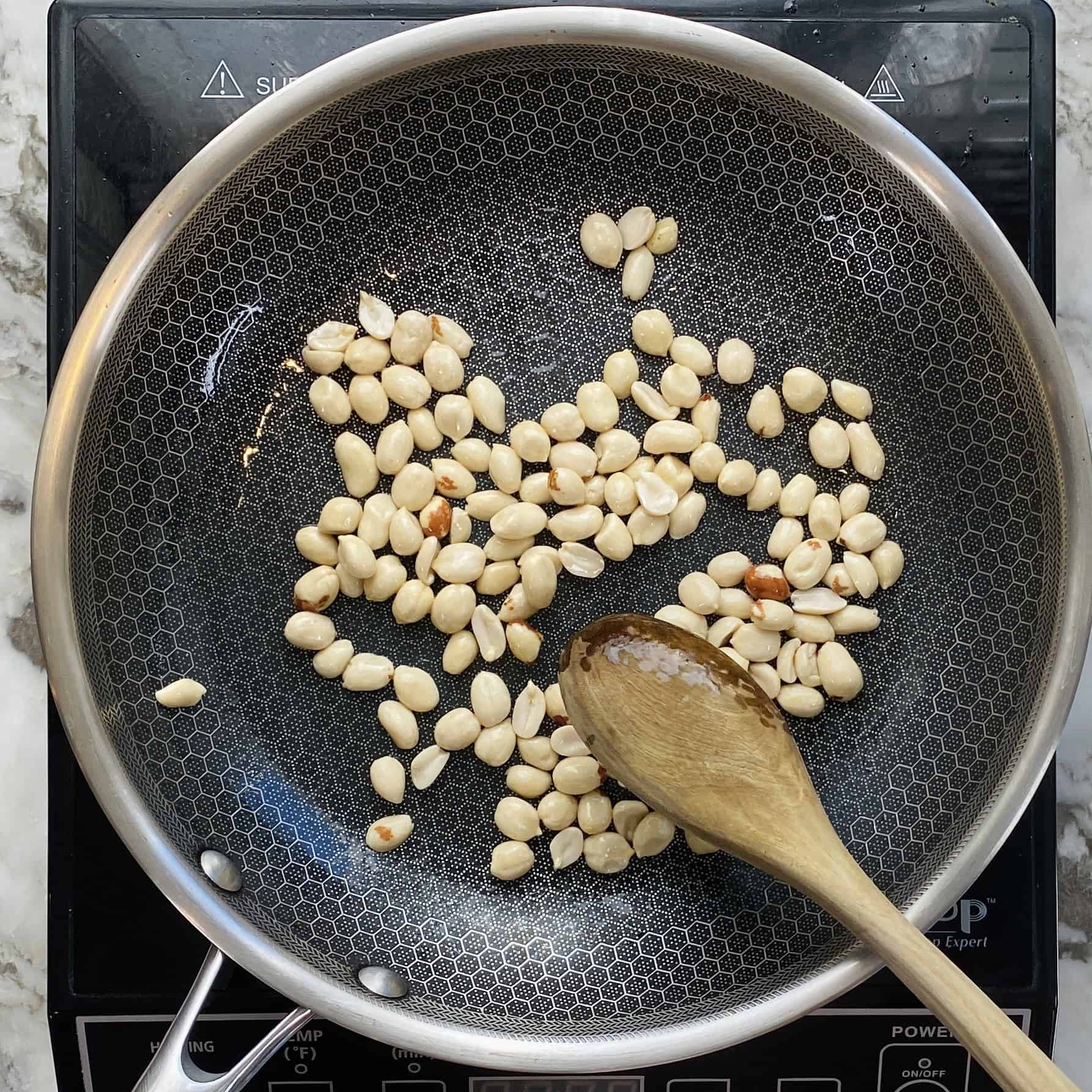 roasting peanuts in a pan. 