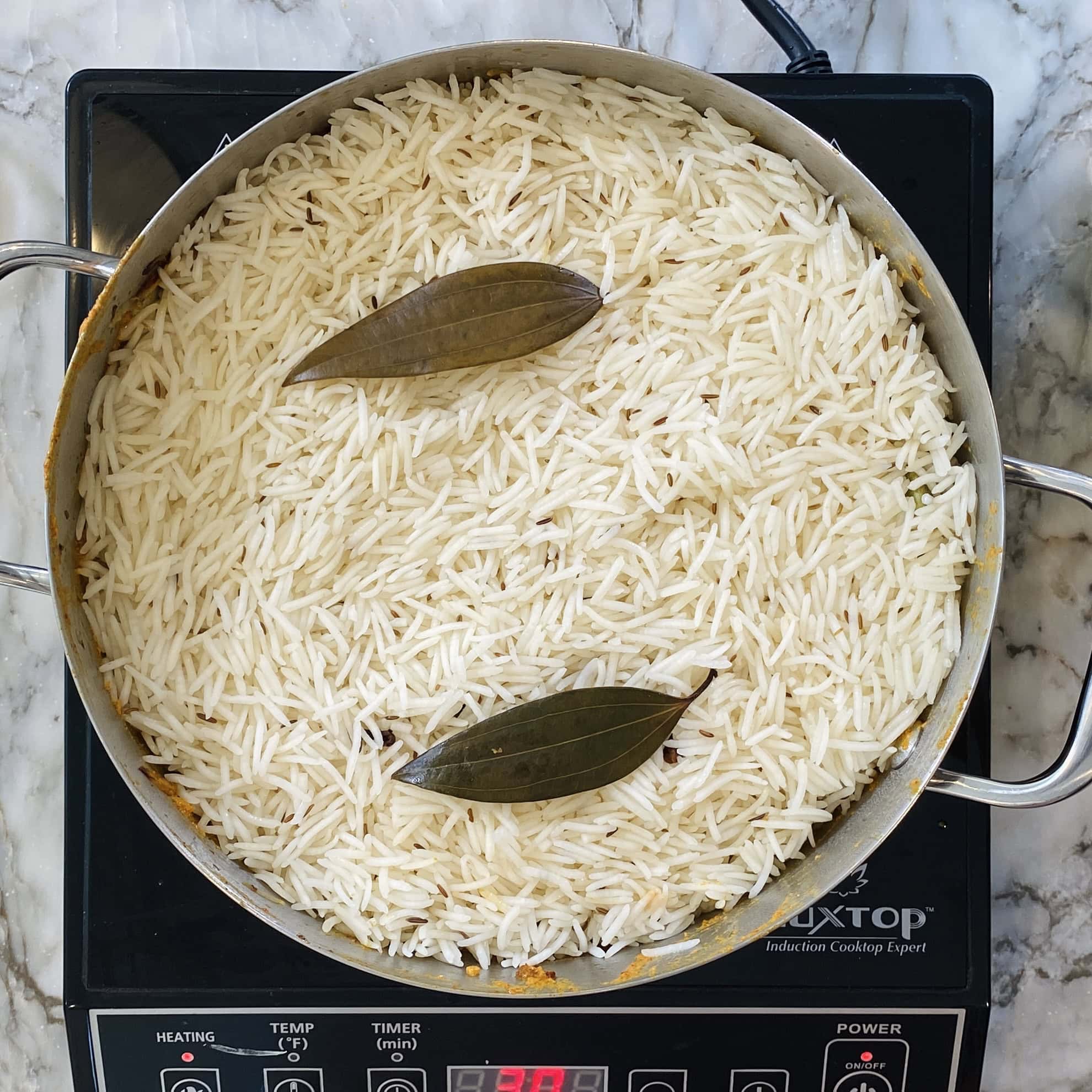 basmati rice layered in a pot 