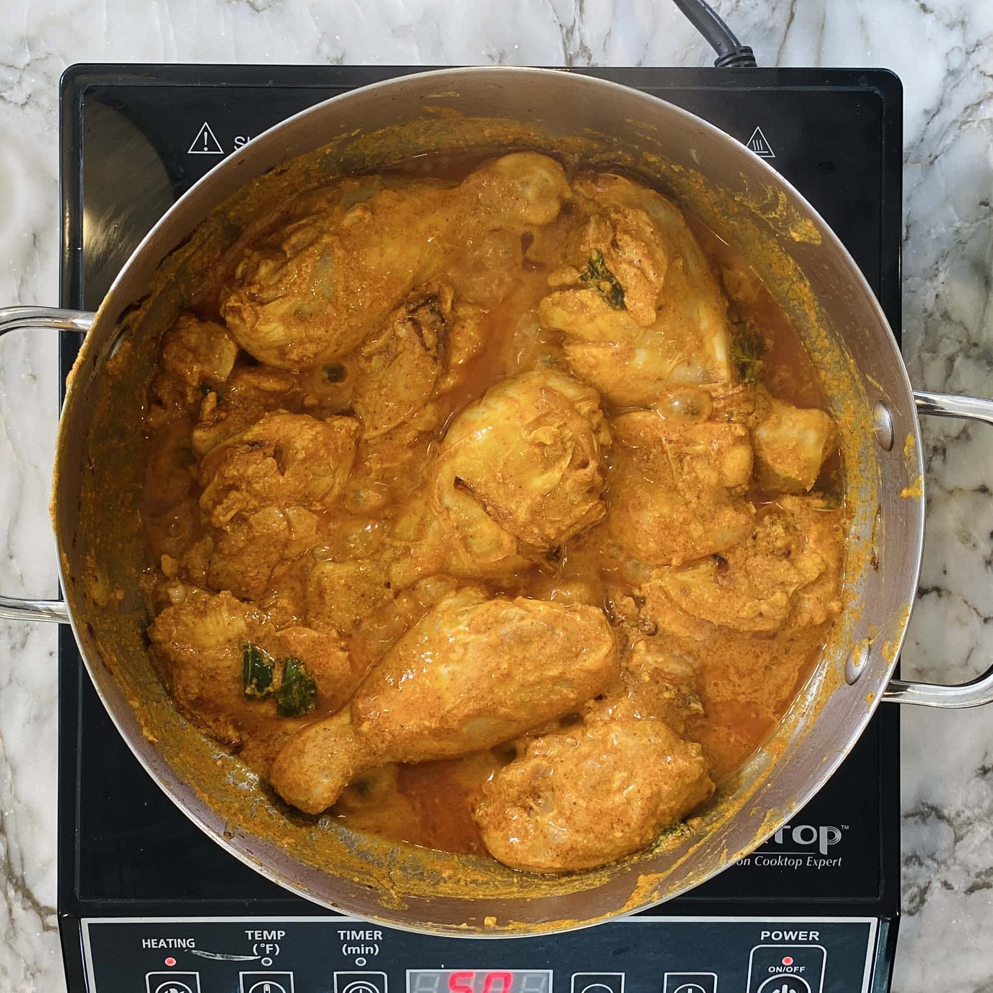 sauteeing chicken in a pot 