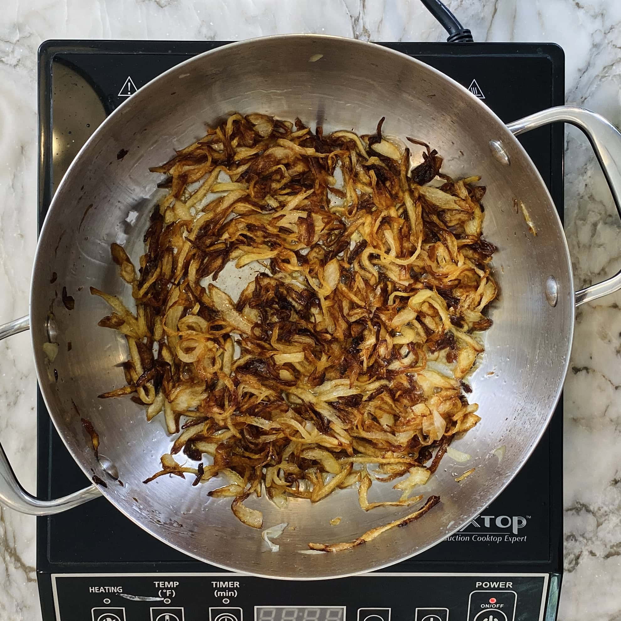 fried onions in a pan 