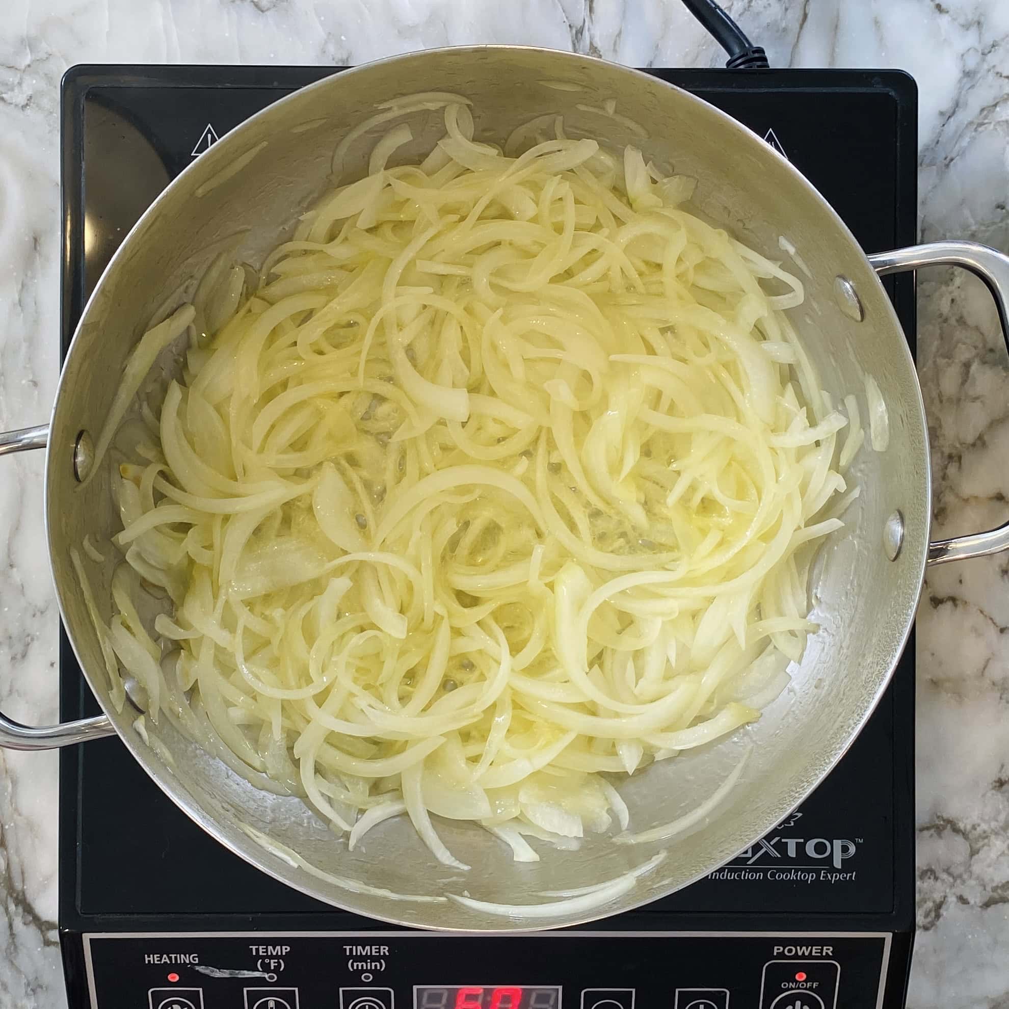 yellow onions in a kadai 