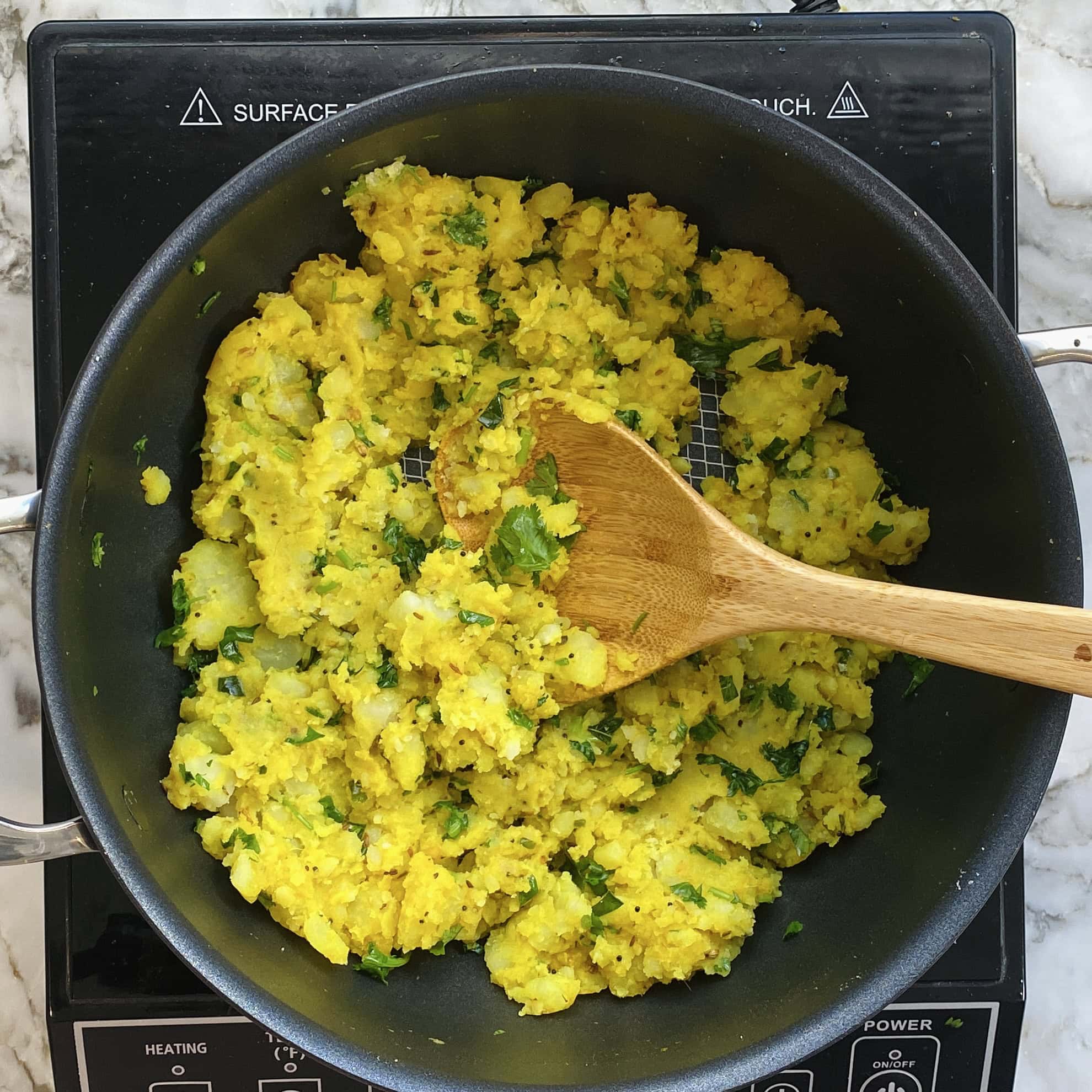 spicy potato mixture in a nonstick pan  