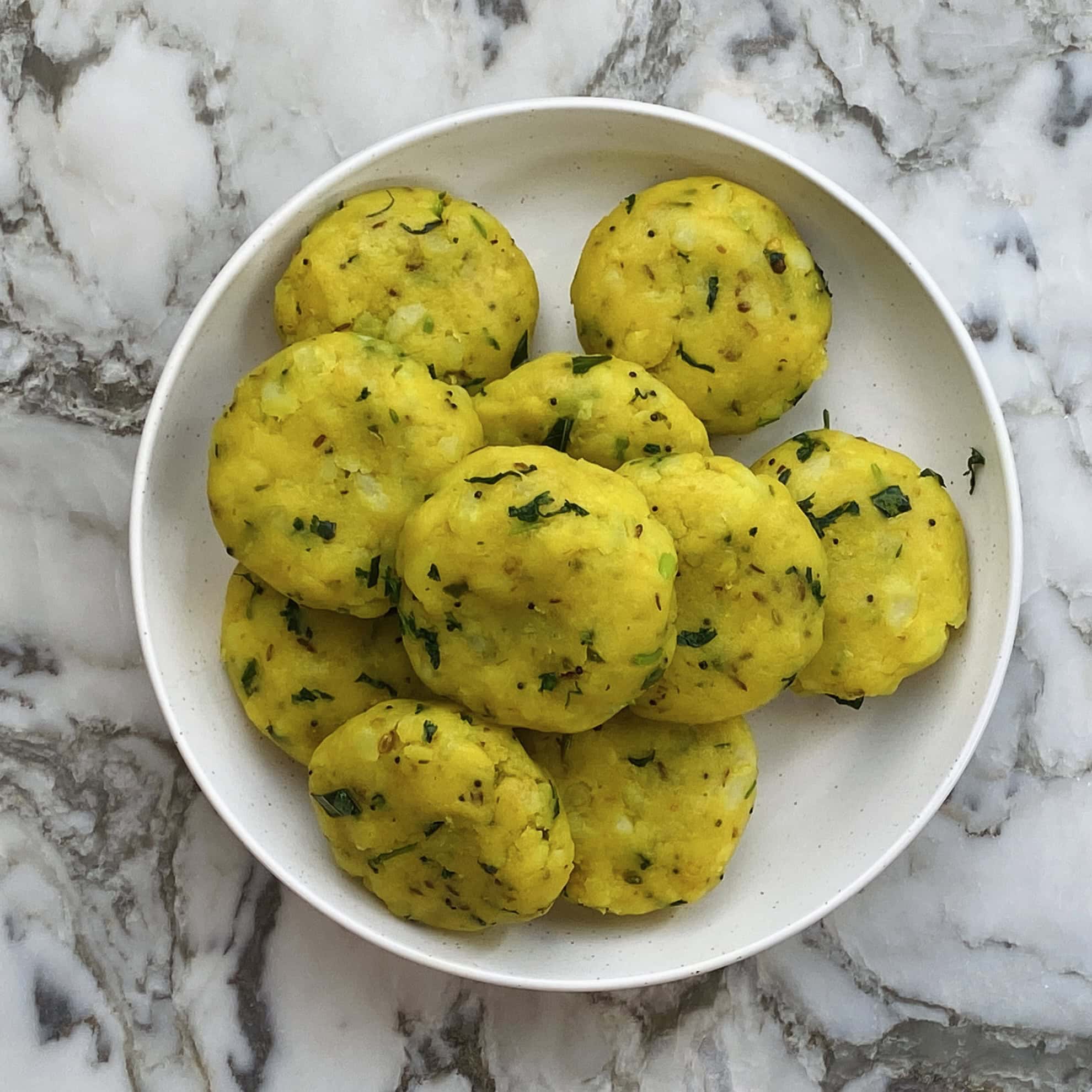 potato filling shaped into round patties 