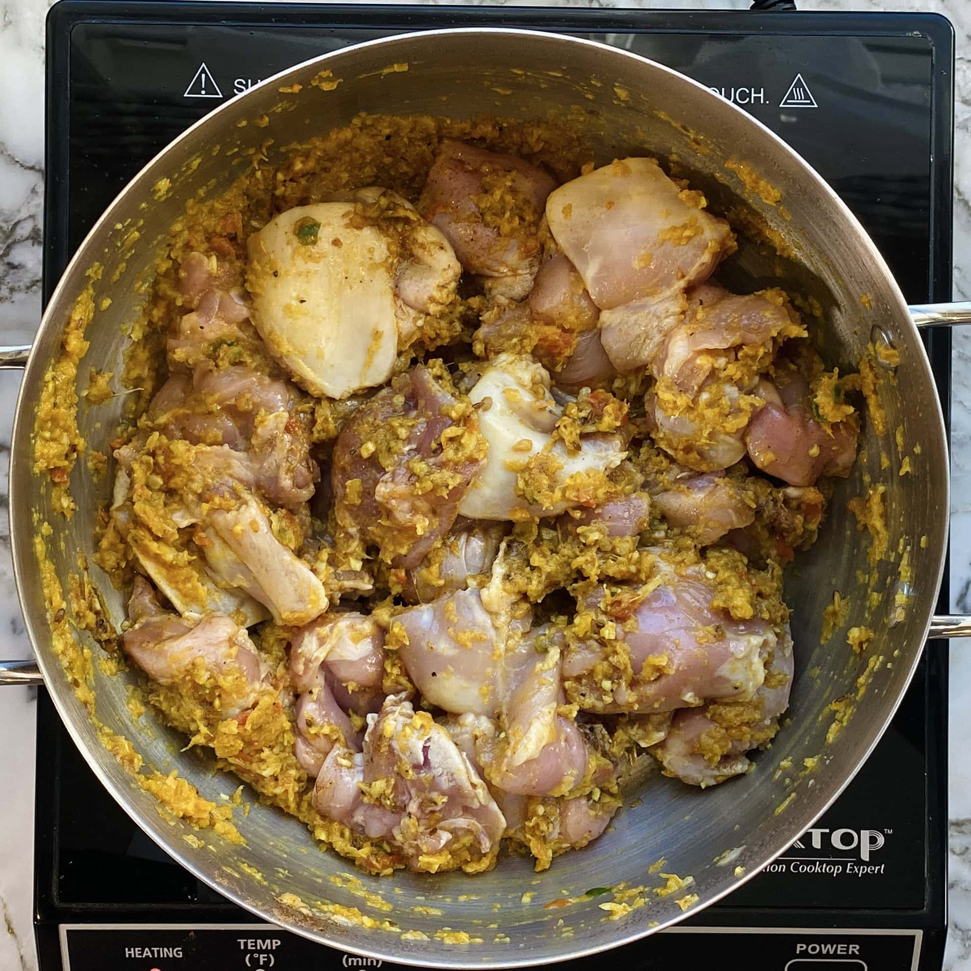sauteeing chicken in a pot 