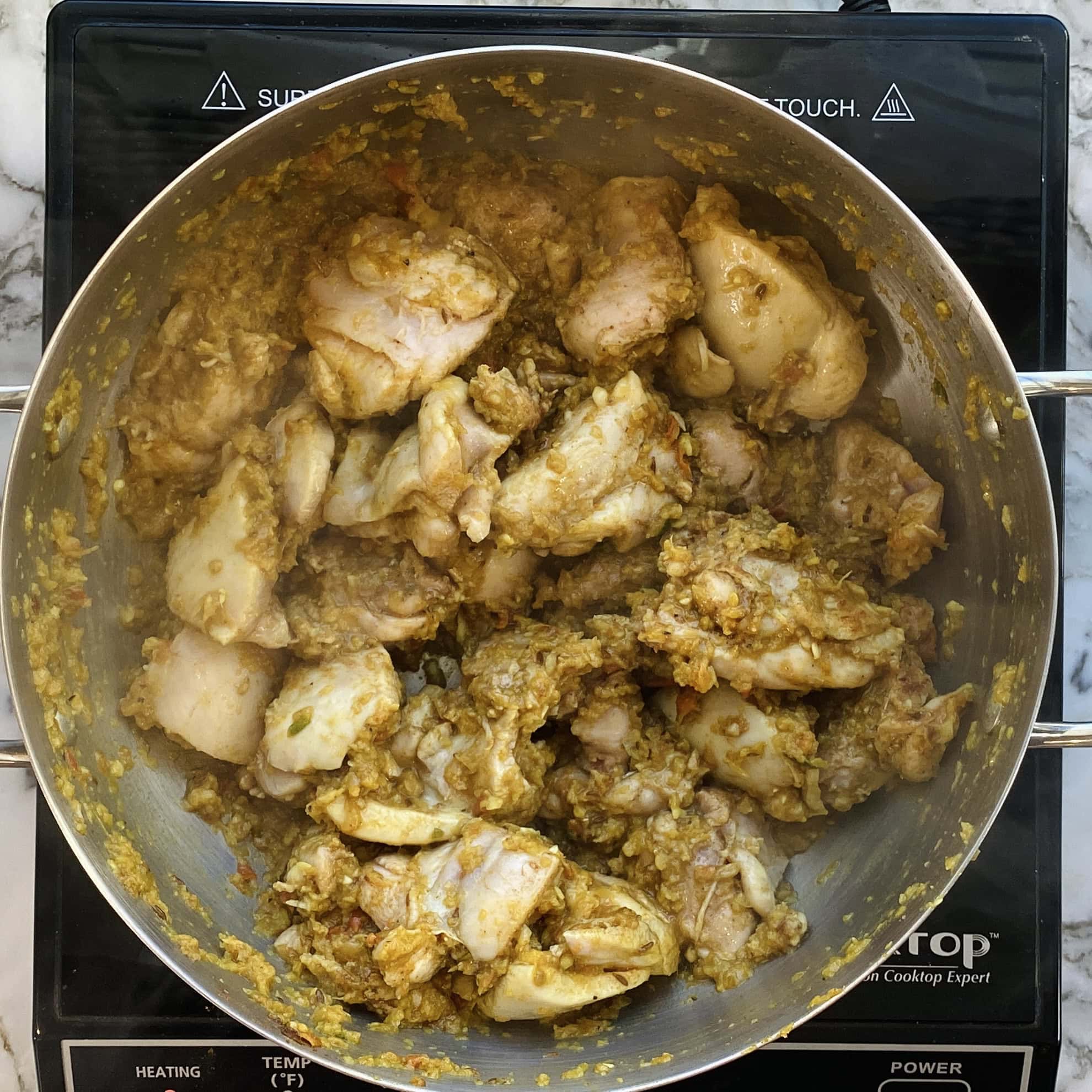 sauteed chicken in a pot 
