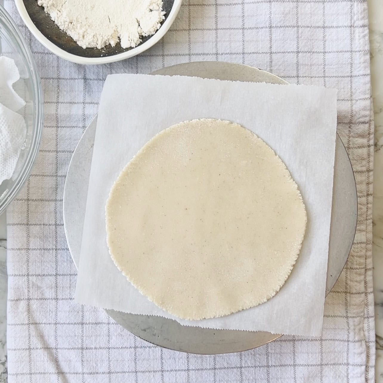 rolled jowar roti on parchment paper
