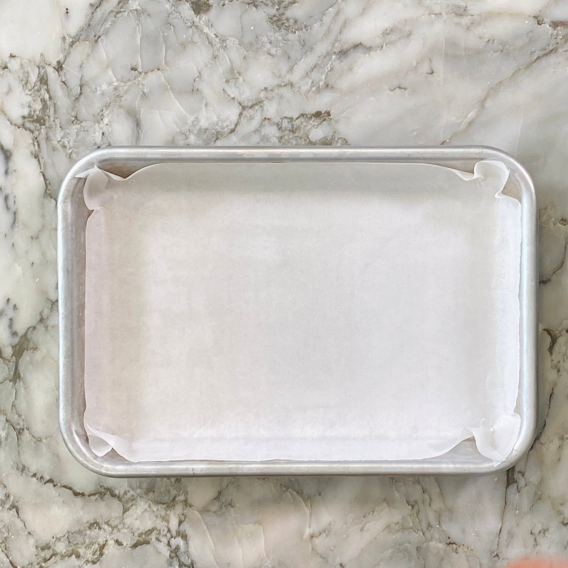 aluminum tray lined with parchment paper 