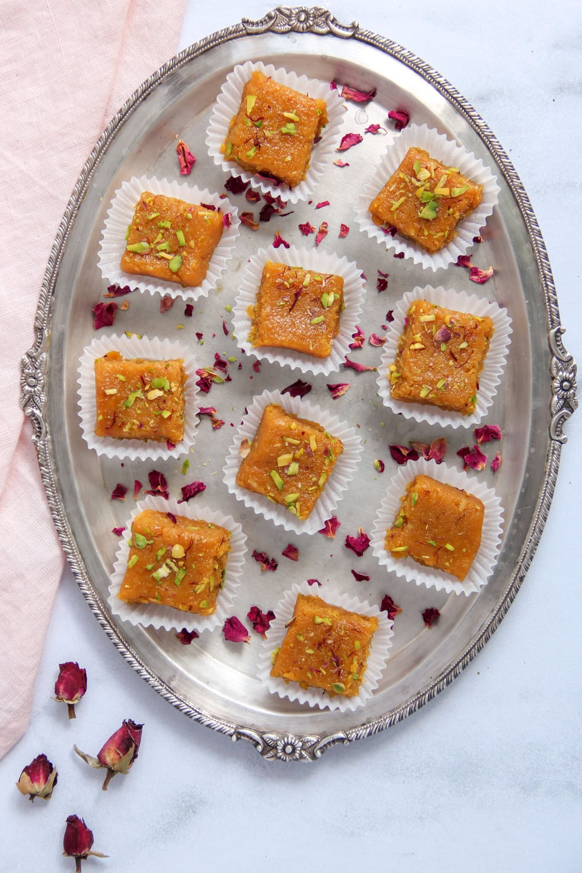 mango coconut barfi in a silver platter