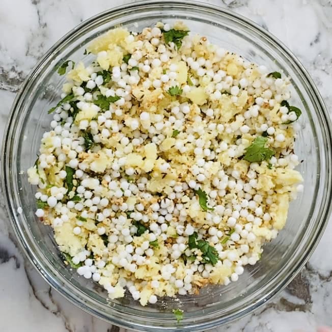 mixed ingredients for sabudana thalipeeth in a bowl