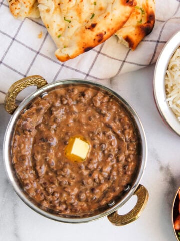 Dal Bukhara served in a kadai with dollop of butter