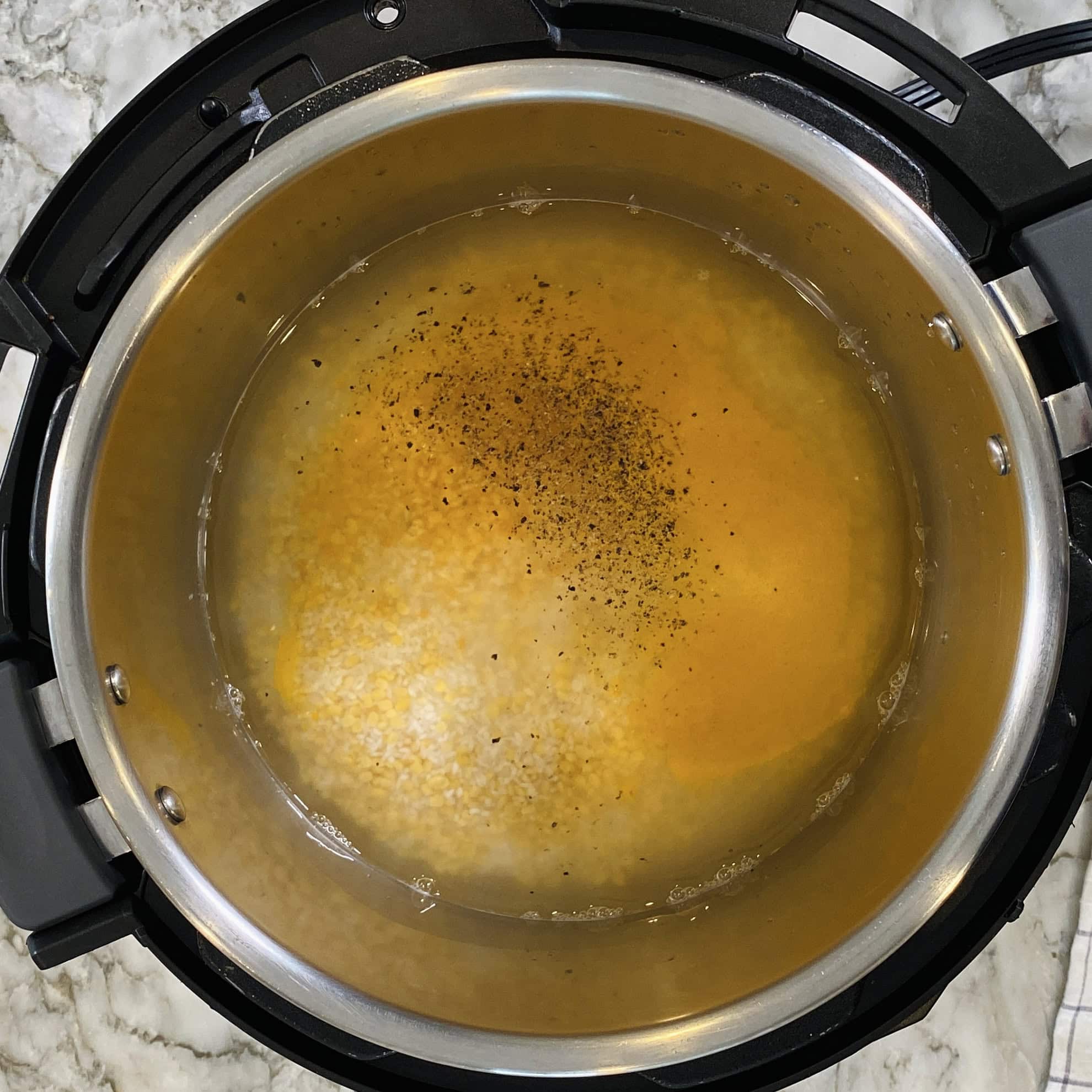 rice, lentils, spices and water in Instant Pot