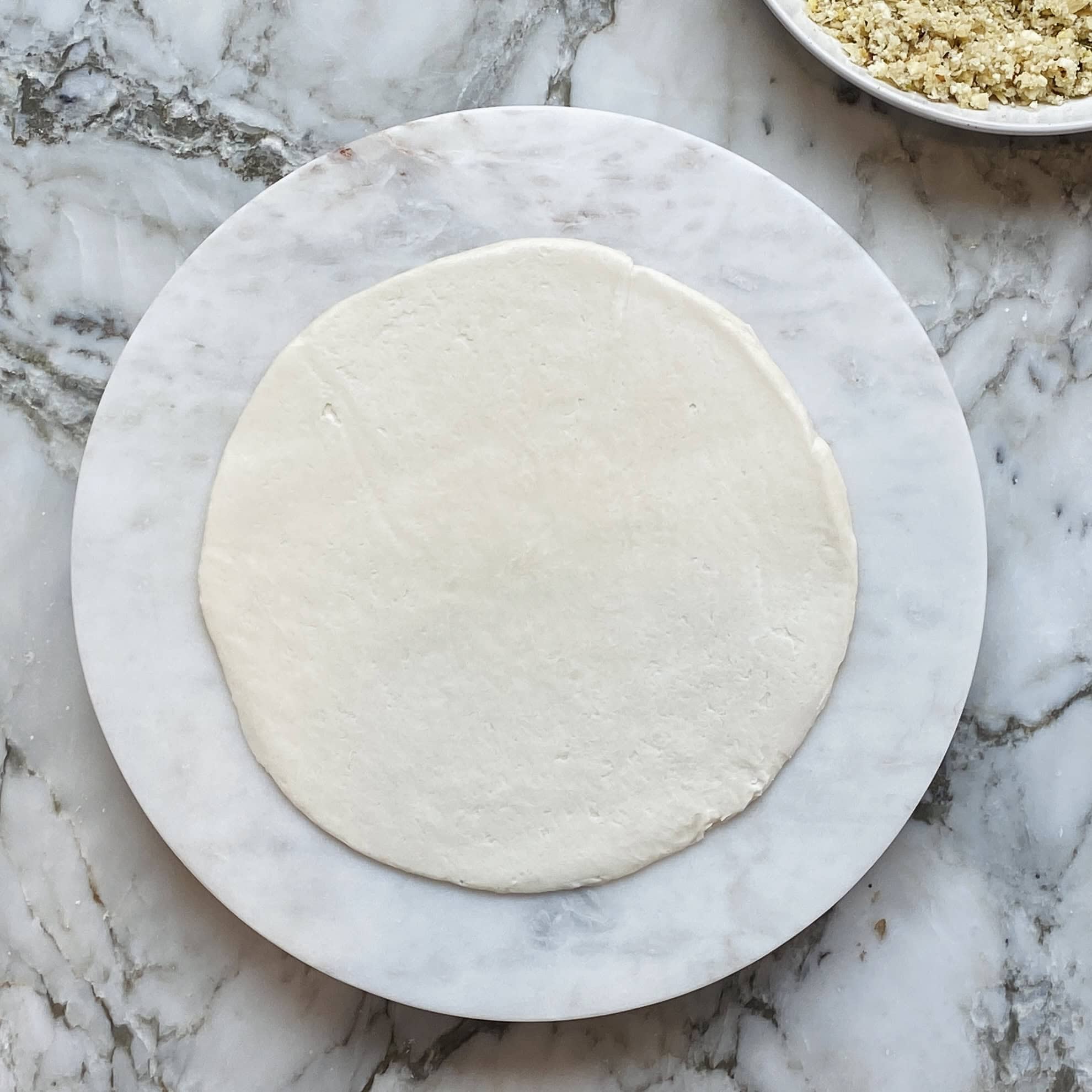 Kawan paratha on a rolling board
