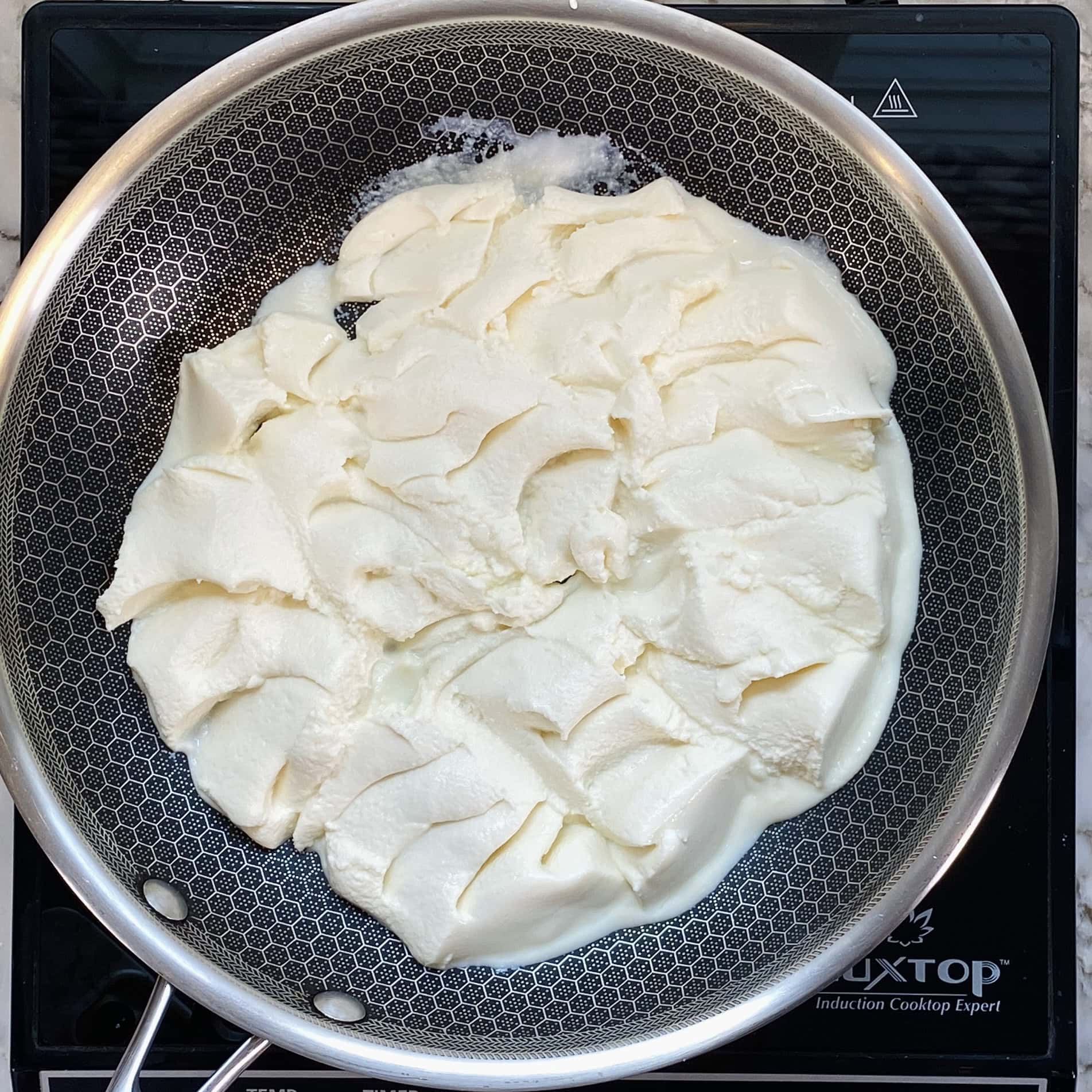 ricotta cheese in a nonstick pan 