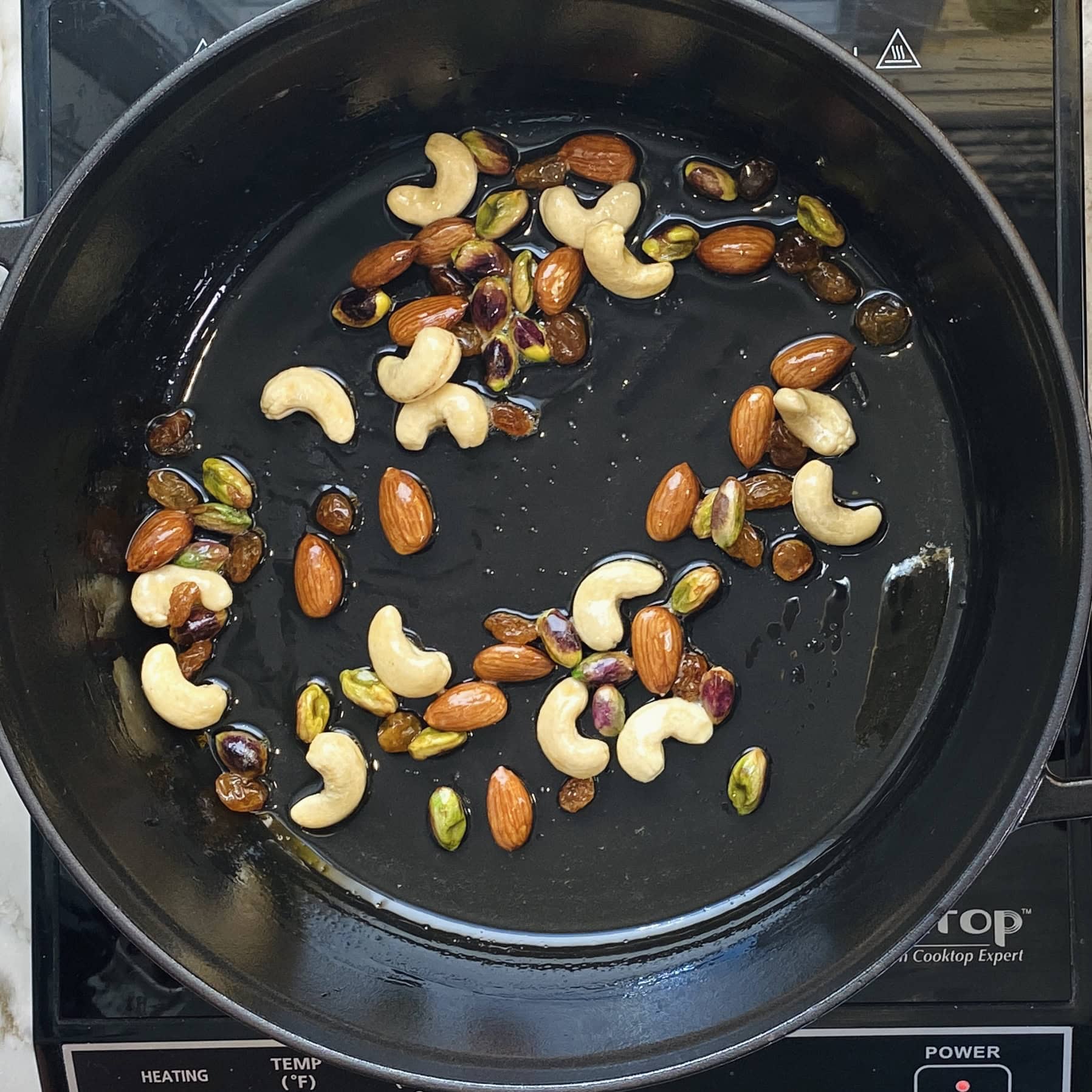 frying nuts in a pan 