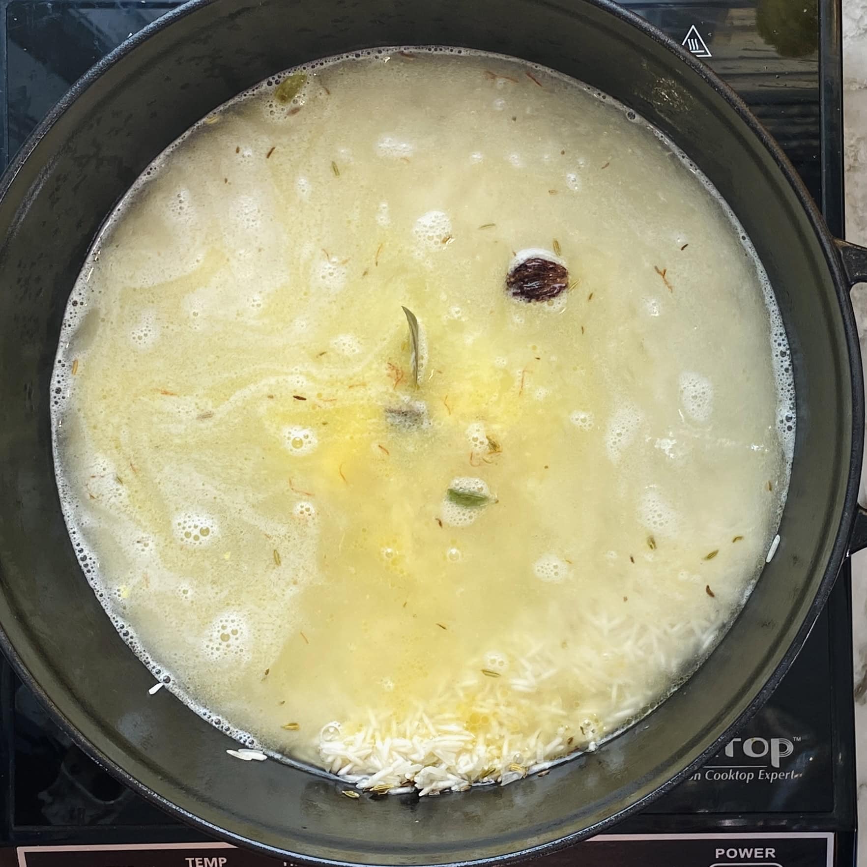 basmati rice with spices and water 