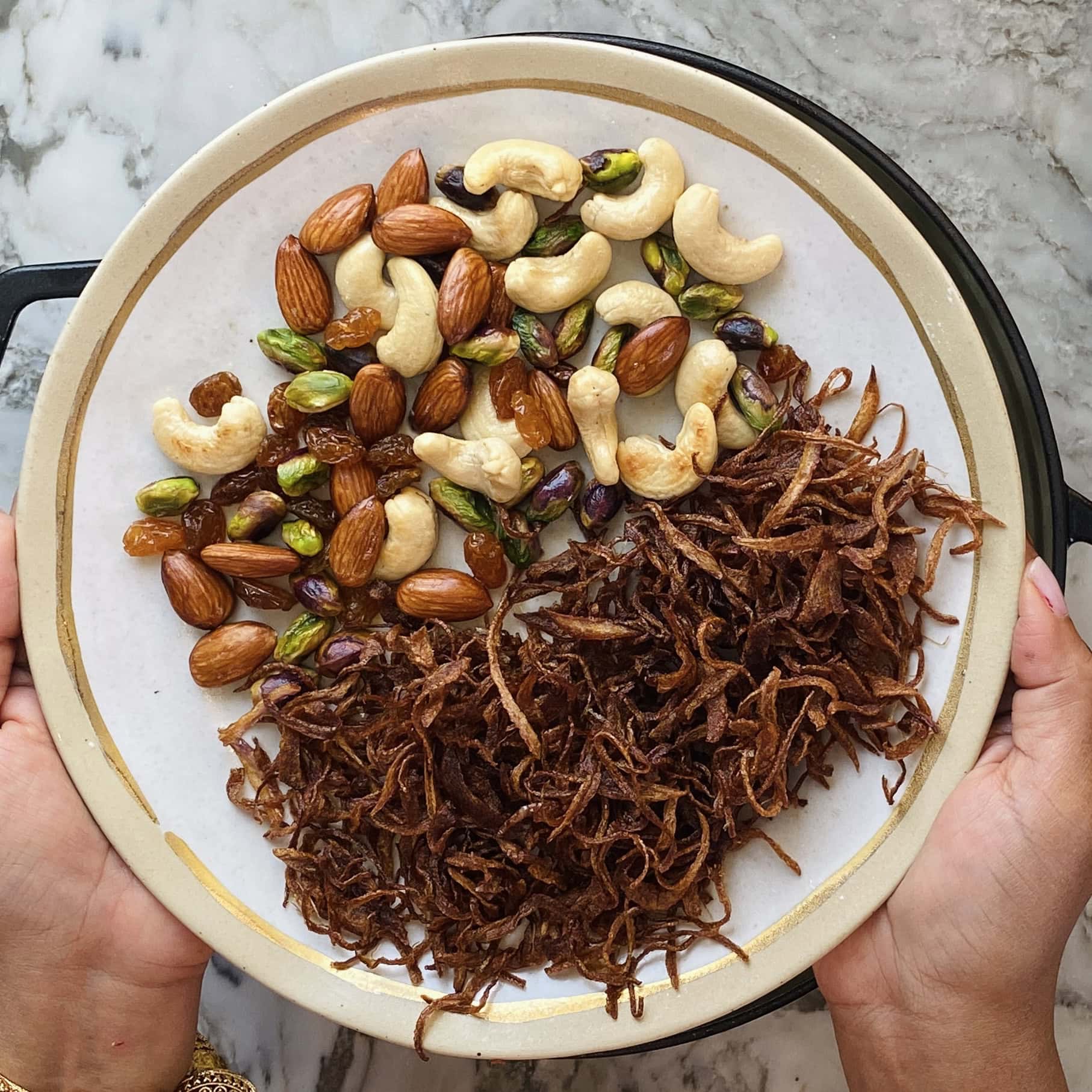 fried nuts and onions in a bowl 