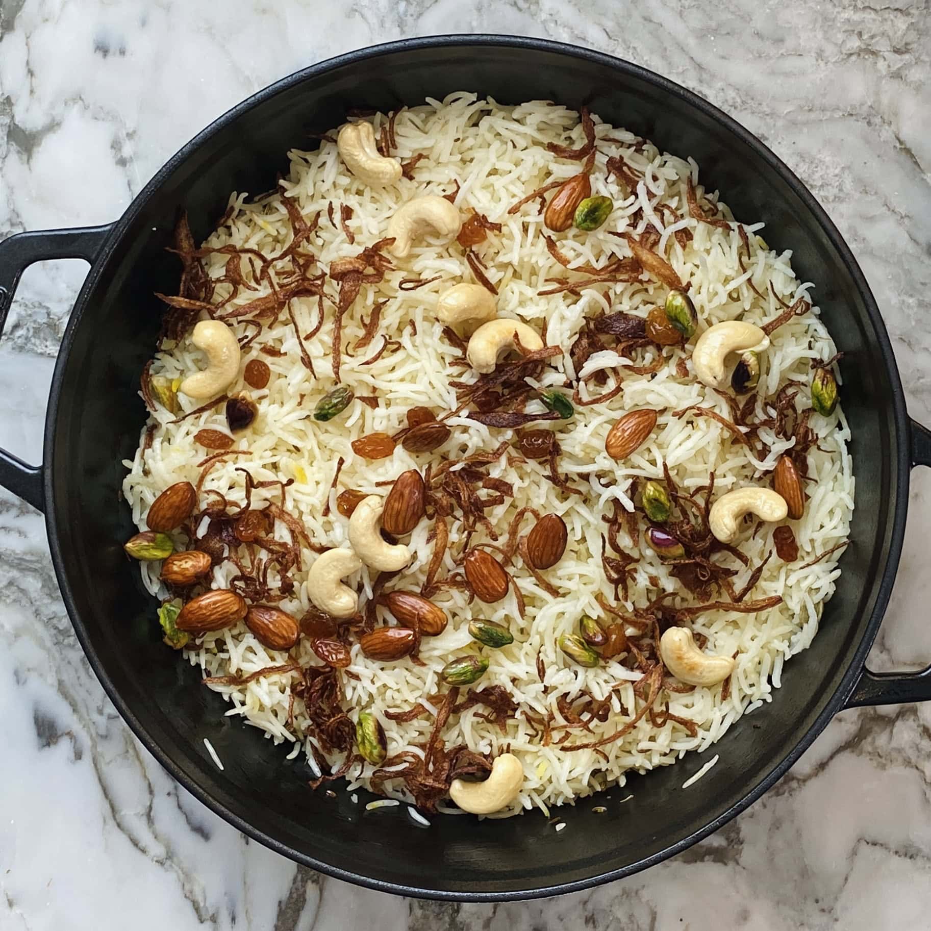 basmati rice garnished but fried onions and nuts 