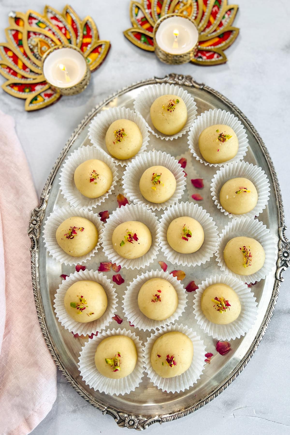 malai laddu served in a silver platter 