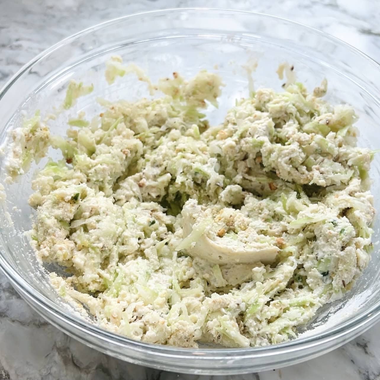 mixed dudhi dhirde ingredients in a bowl