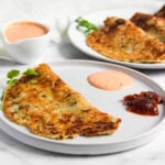 Dudhi Chilla served with chutney and pickle
