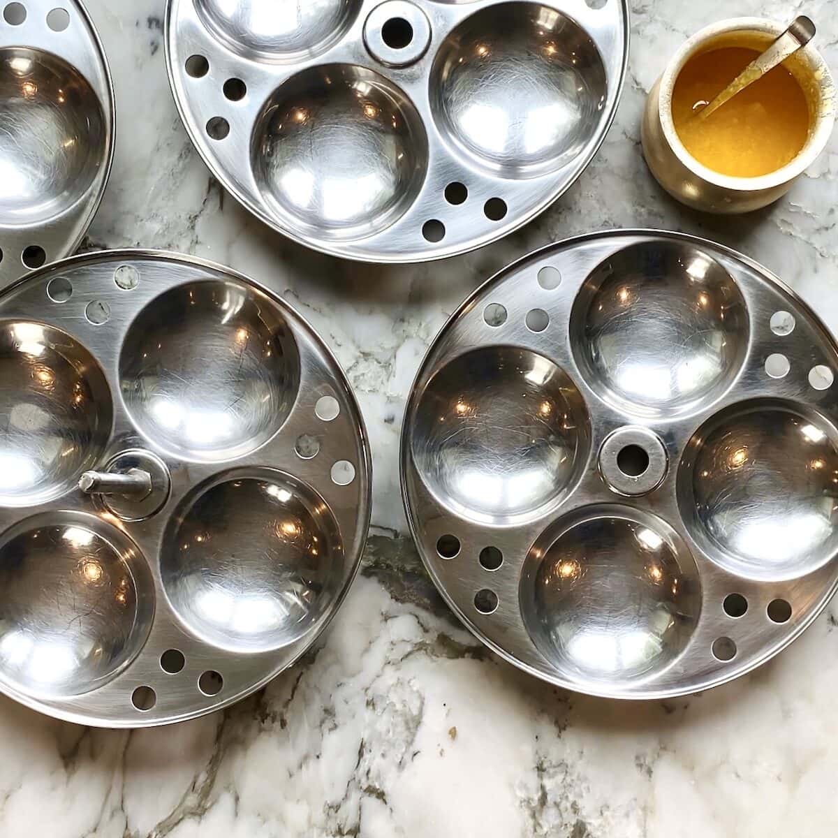 idli plates coated with ghee