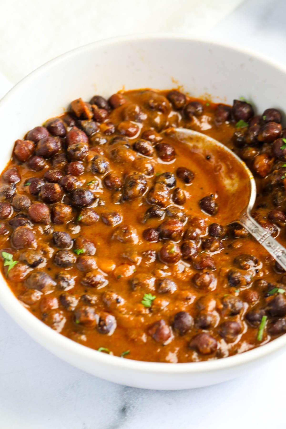 kala chana curry in a bowl.