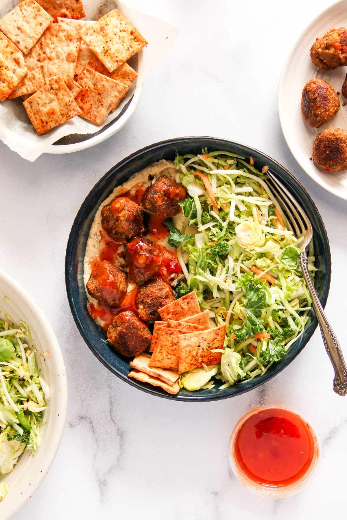 eggplant and chickpea meatballs with sweet and spicy sauce and superfoods salad