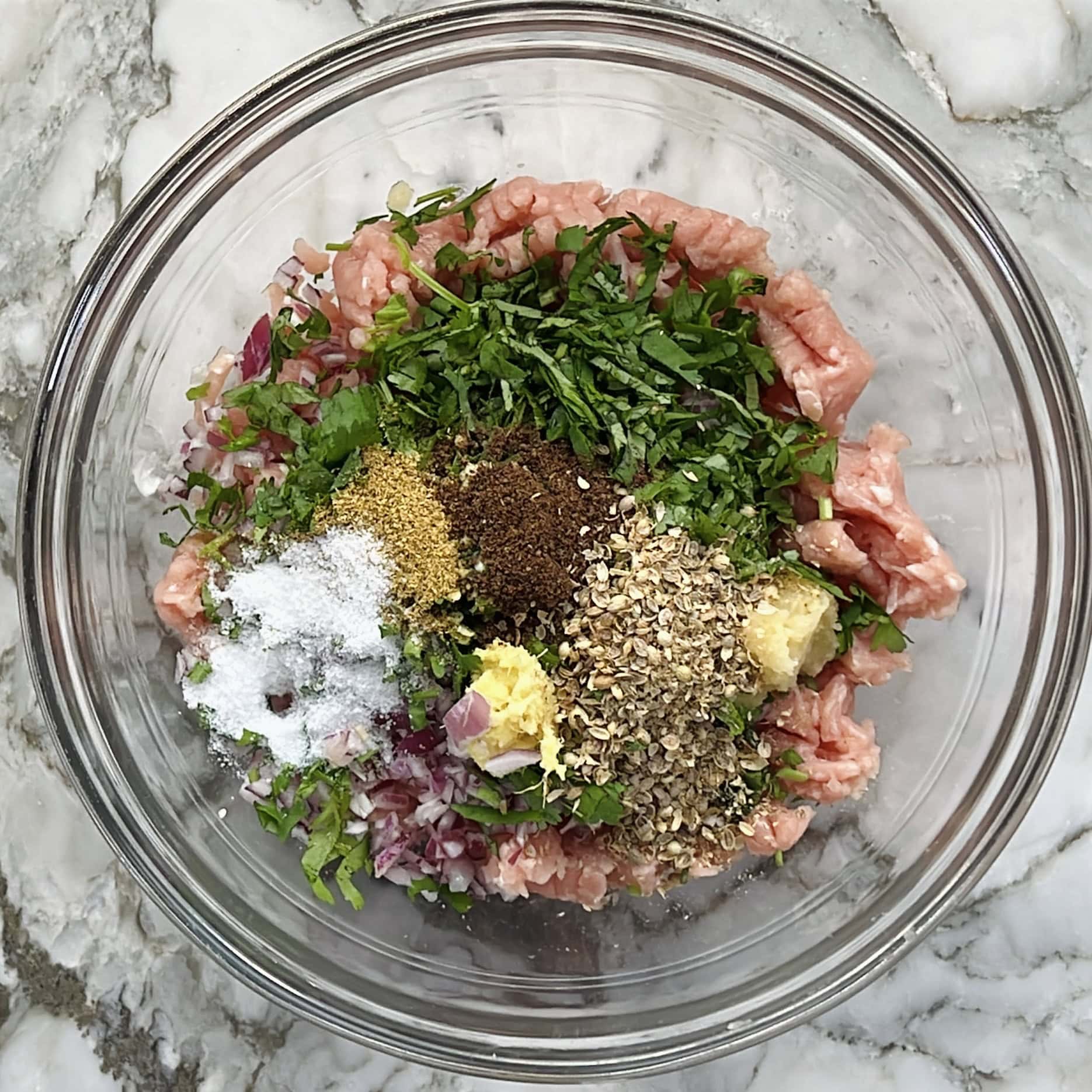 ground chicken with spices in a bowl