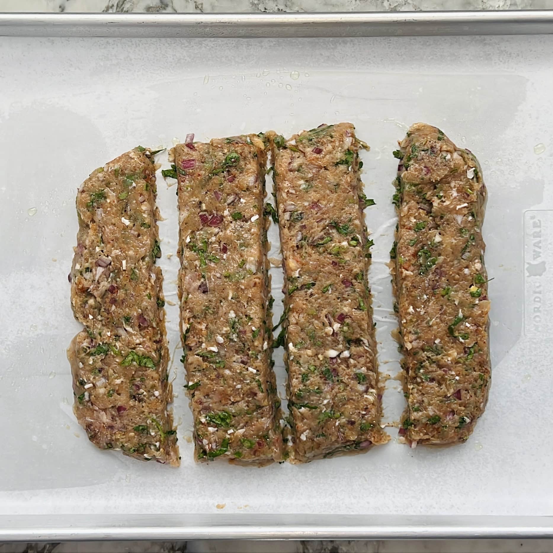 kebab mixture on a sheet pan