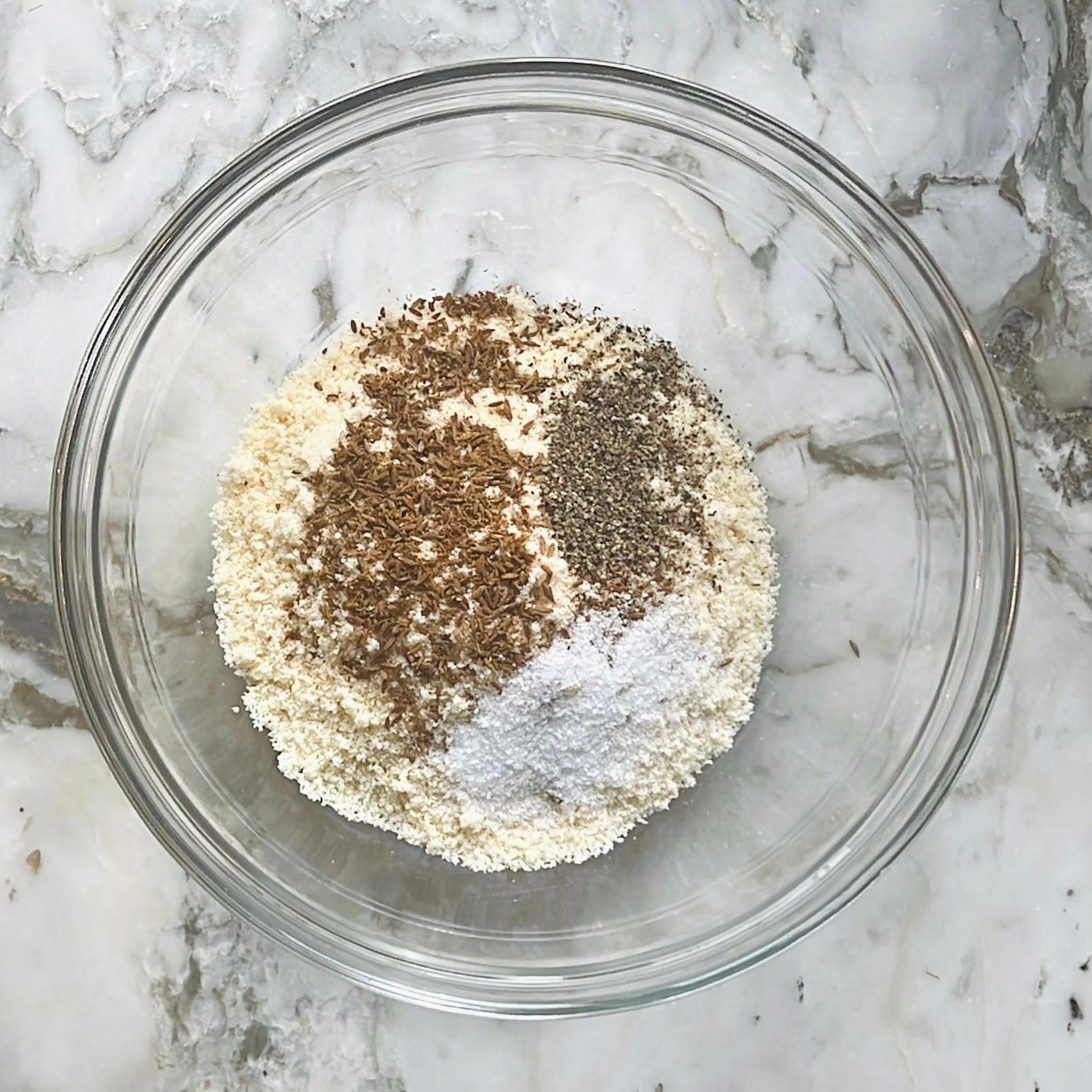 dry ingredients for bagel bites in a mixing bowl