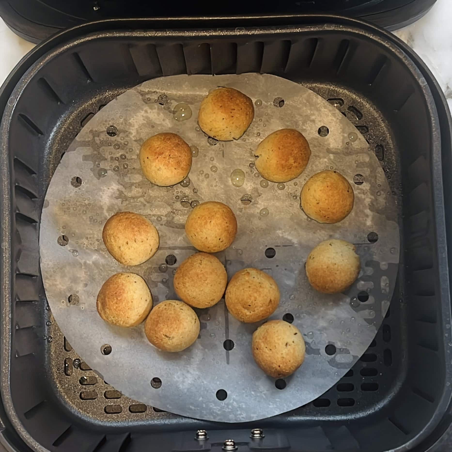 golden cooked cumin bagel bites in an air fryer
