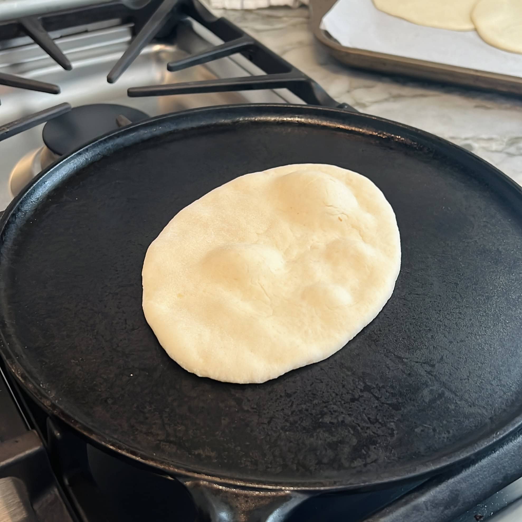 naan on a hot pan.